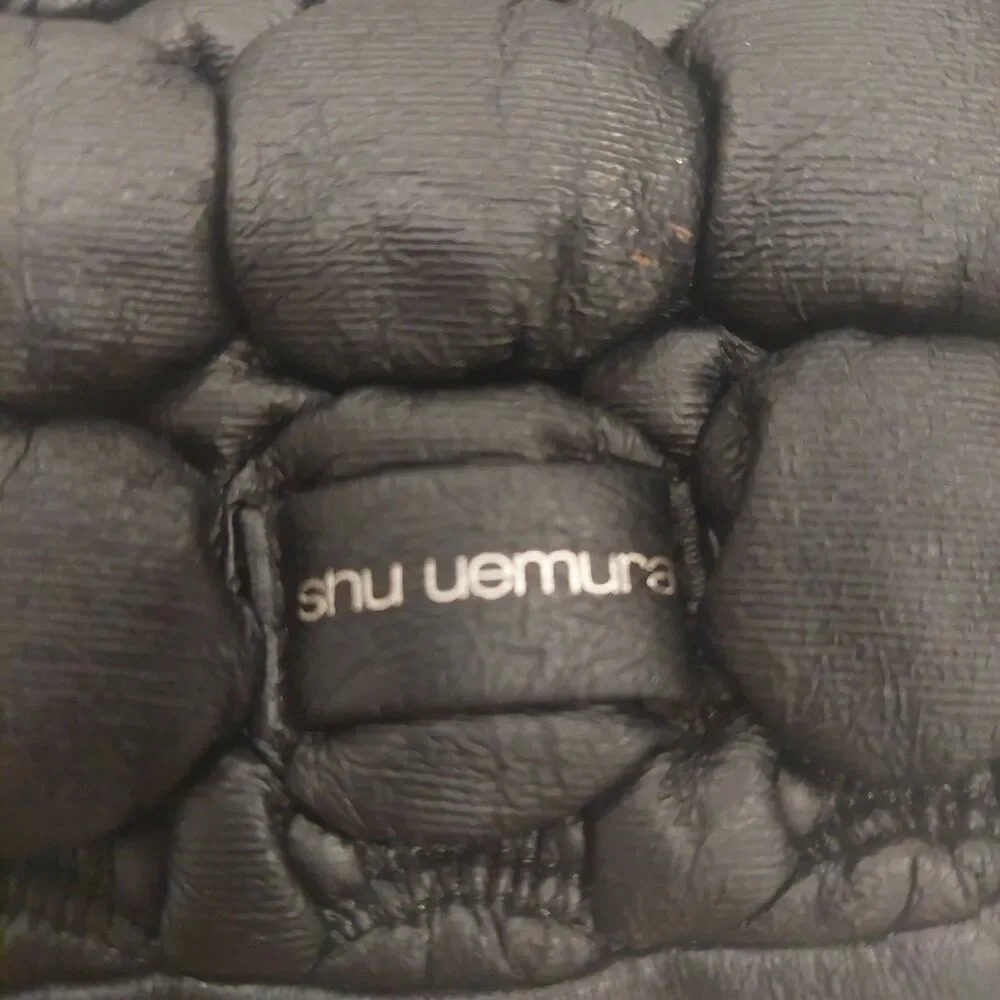 black quilted novelty cosmetic pouch from Shu Uemura